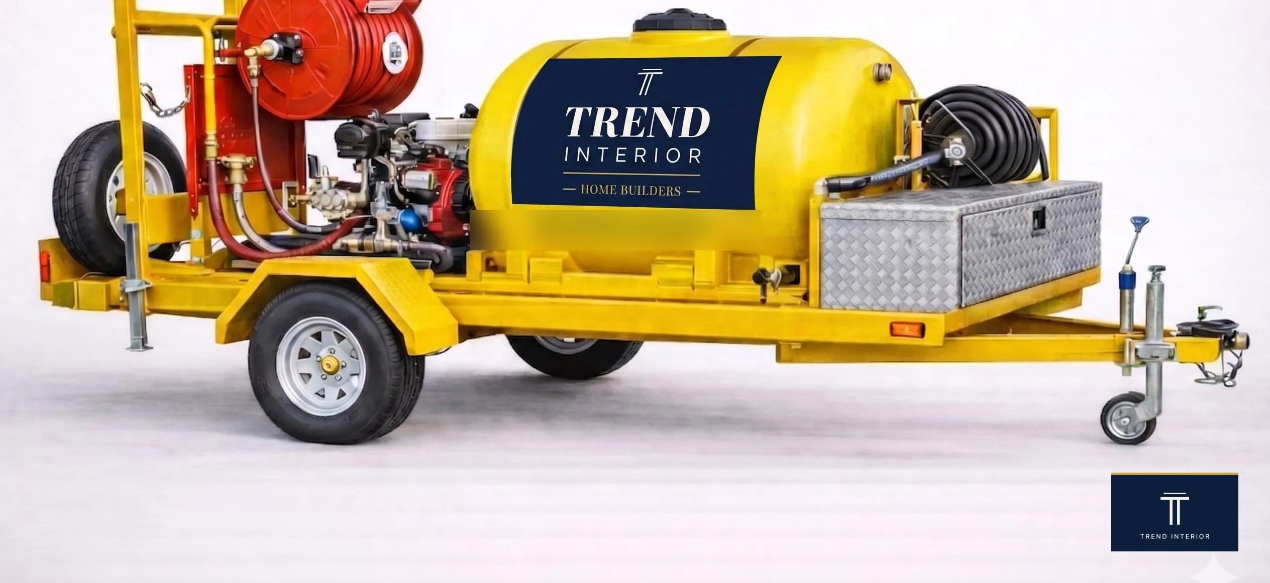 Trend Interior Home Builders jetting rig: yellow trailer with 500L horizontal tank, pressure pump, twin hose reels.